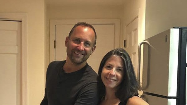 Jason and Dana Woods together in their kitchen