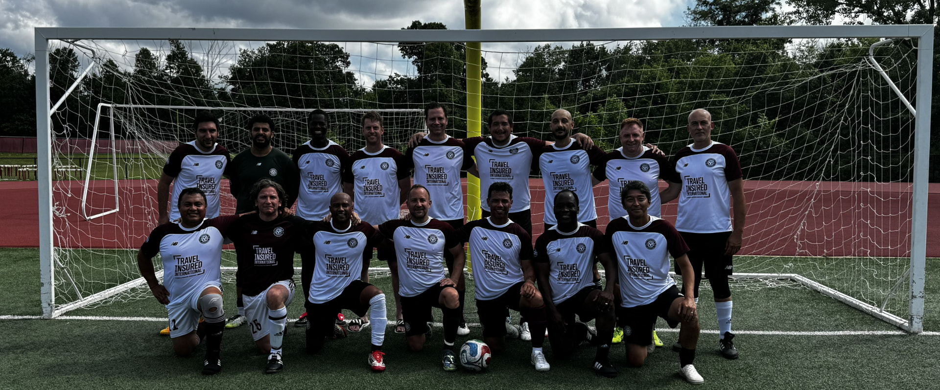 Jason Woods with his Verona adult recreational soccer team in front of the goal